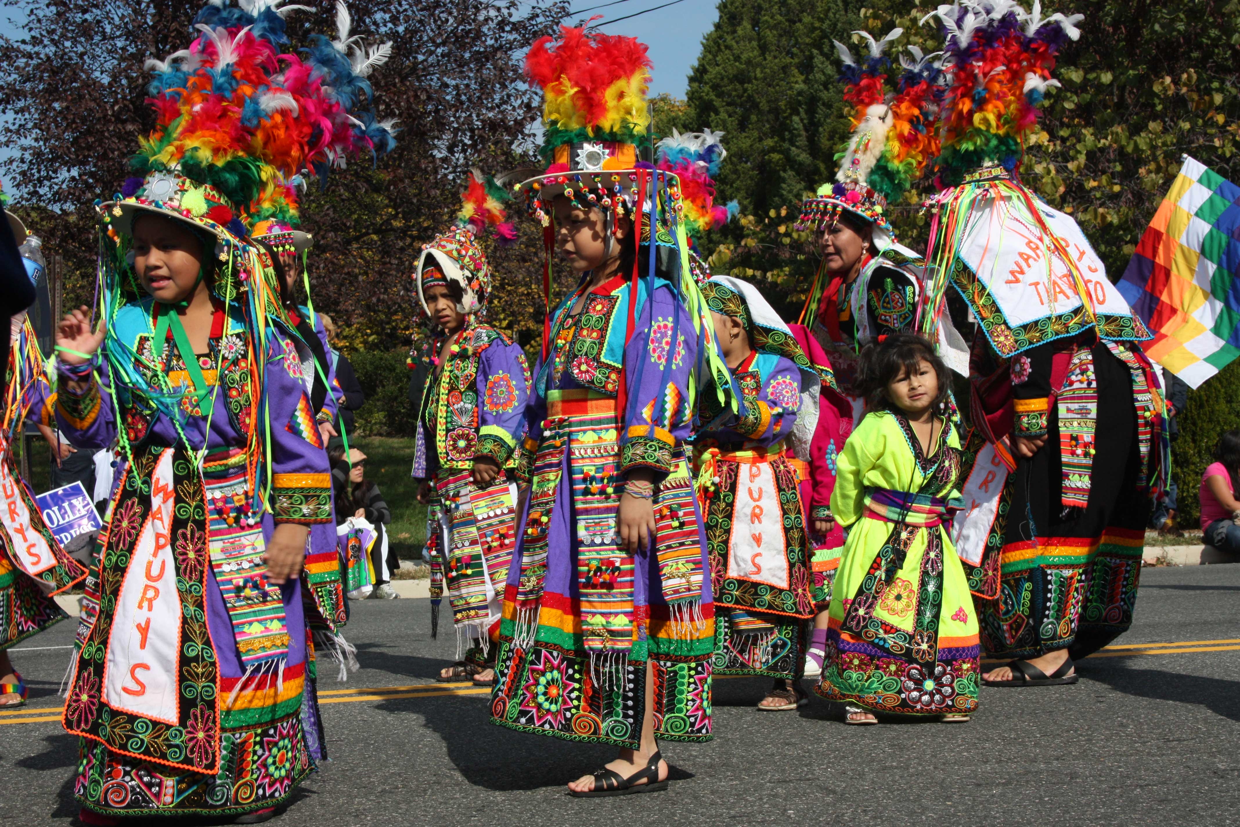 Bolivian Dancers in colorful native costumes grace the parade with color, dance, and toe tapping musi
